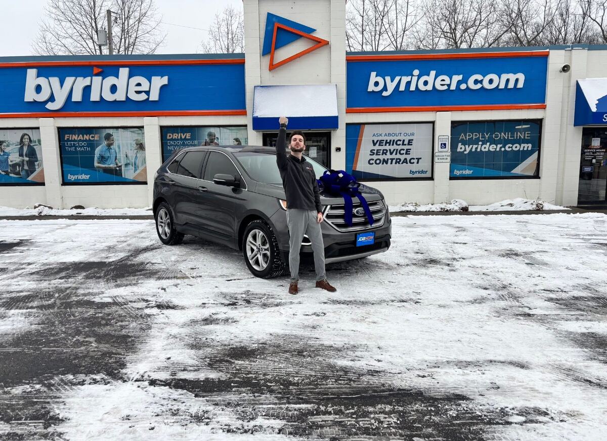 York celebrating a vehicle delivery at Byrider Amherst