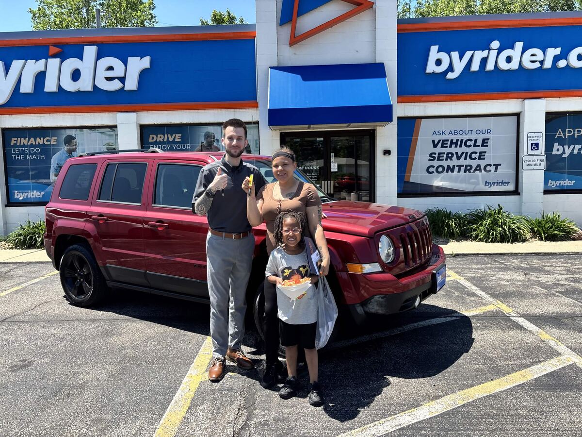 York handing over the keys to a family at Byrider Amherst